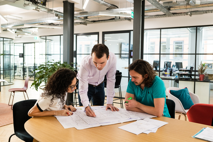 Raffoul consulting team looking at engineering drawings